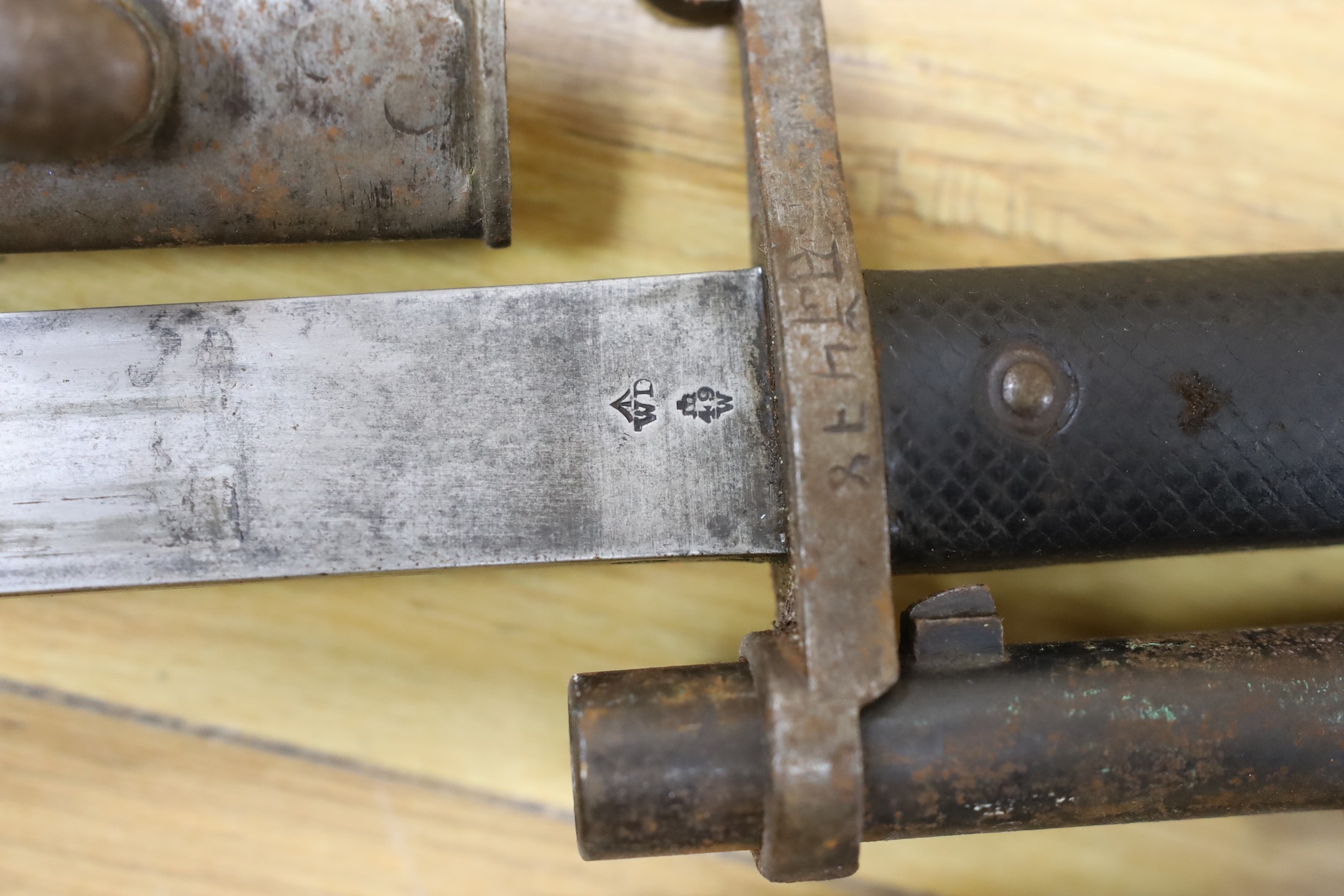 An Enfield breech loading .577 calibre rifle dated 1886, with Wilkinson bayonet and sheath